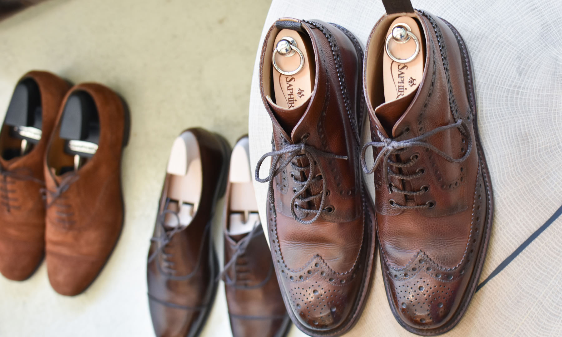 Different models shoe trees in leather shoes